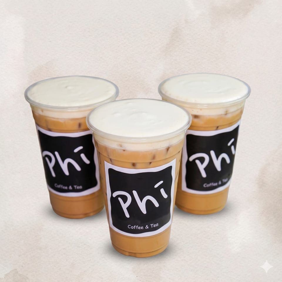 Three Phi Coffee & Tea iced lattes with creamy foam tops on a light background.